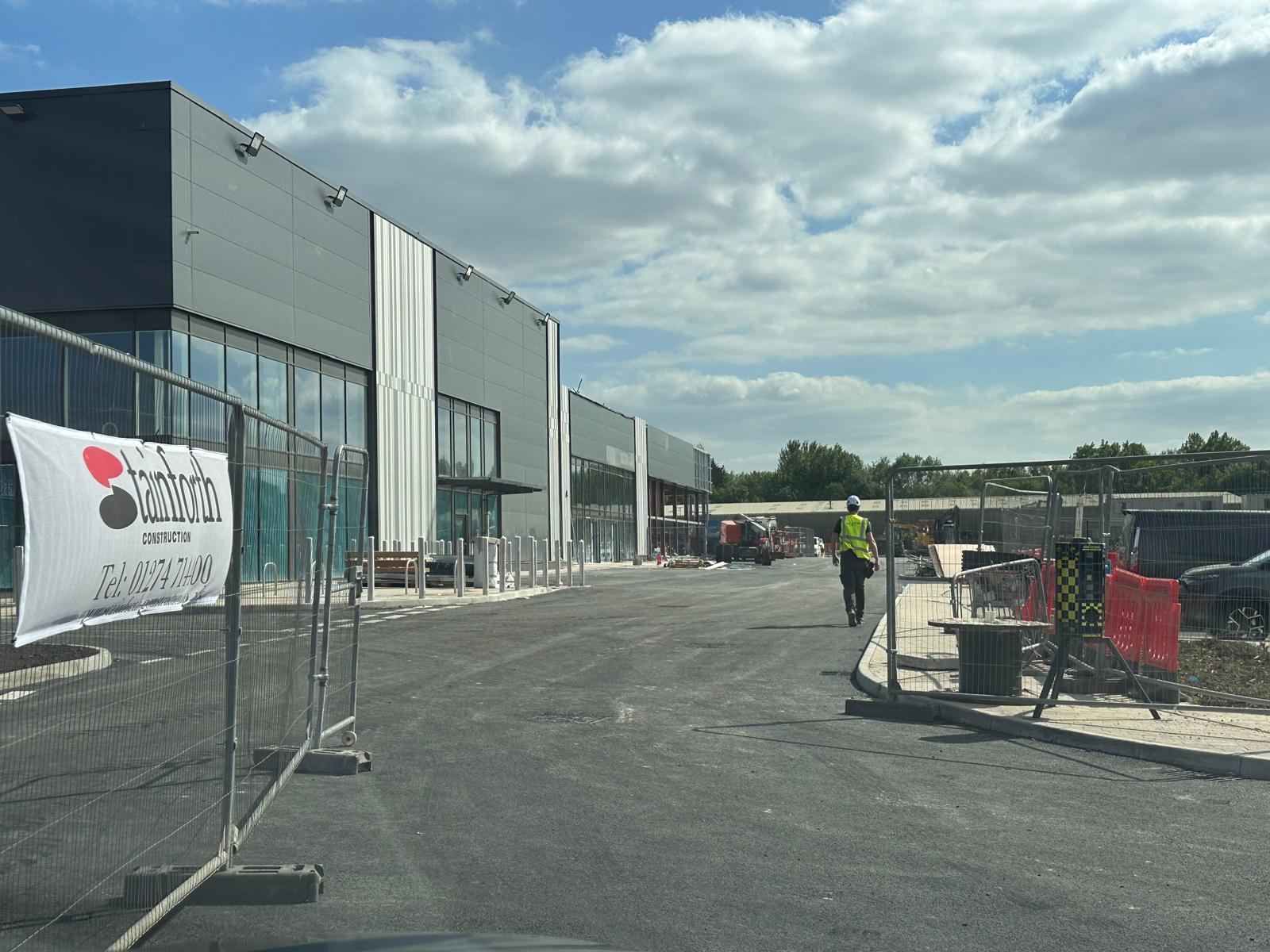 Construction progress on new Tesla showroom and Supercharger station at Liverpool Shopping Park, Edge Lane.